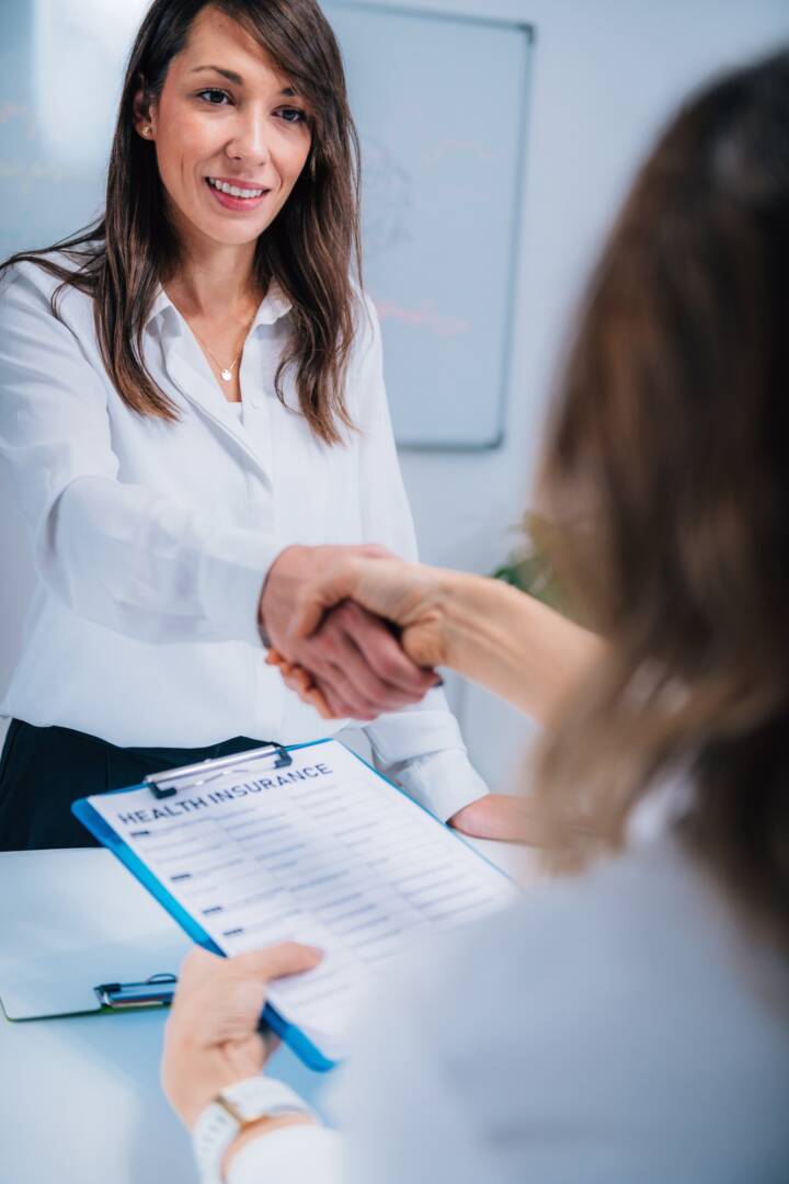Handshake After Signing Health Insurance Form